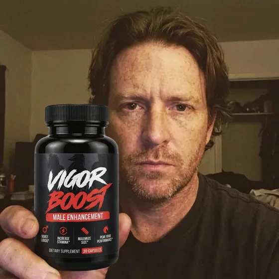 A VigorBoost&reg; customer holding the bottle